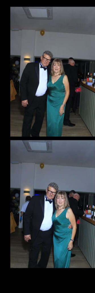 Couple in formal attire at an event.