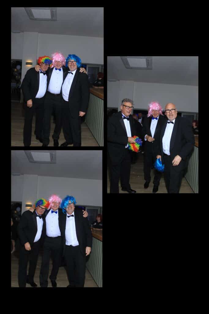 Men in tuxedos wearing colourful wigs at a party.