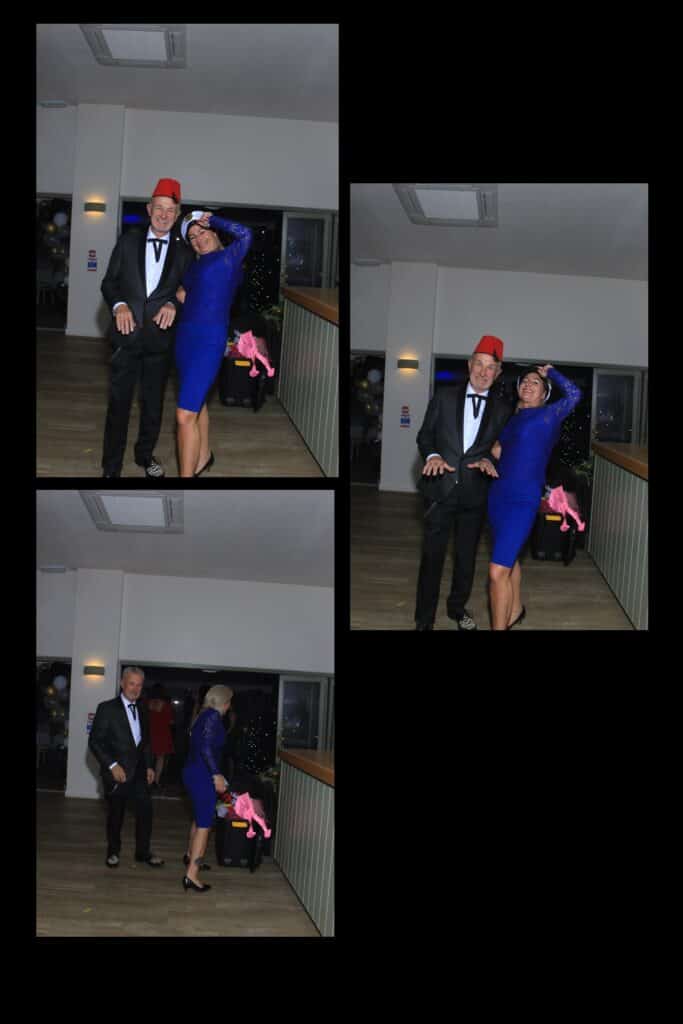 Couple in formal wear at a party, dancing and smiling.